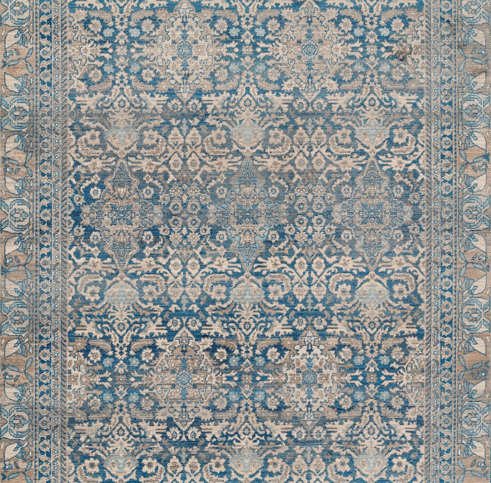 Blue and beige Turkish-inspired ornate rug with distressed floral motifs and decorative border, 2' x 3'.