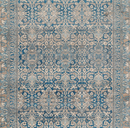 Blue and beige Turkish-inspired ornate rug with distressed floral motifs and decorative border, 2' x 3'.