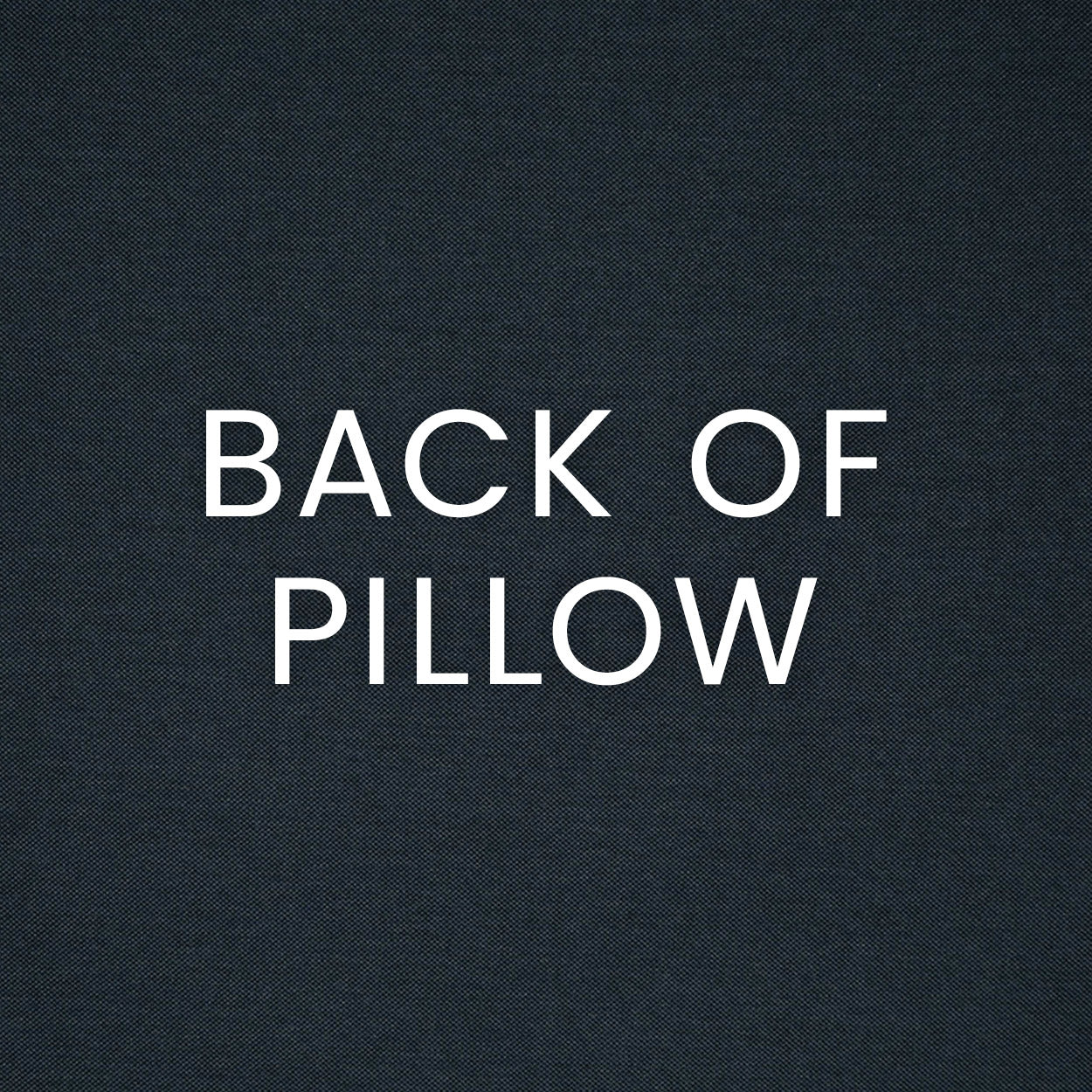 Indigo textured outdoor lumbar pillow fabric with bold white text 'BACK OF PILLOW' across the surface.