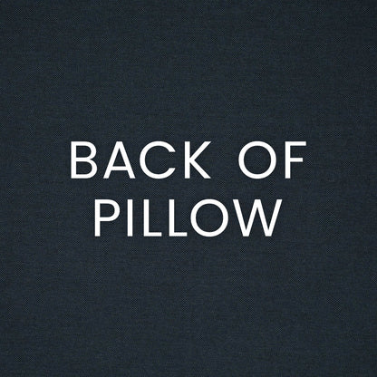 Indigo textured outdoor lumbar pillow fabric with bold white text 'BACK OF PILLOW' across the surface.