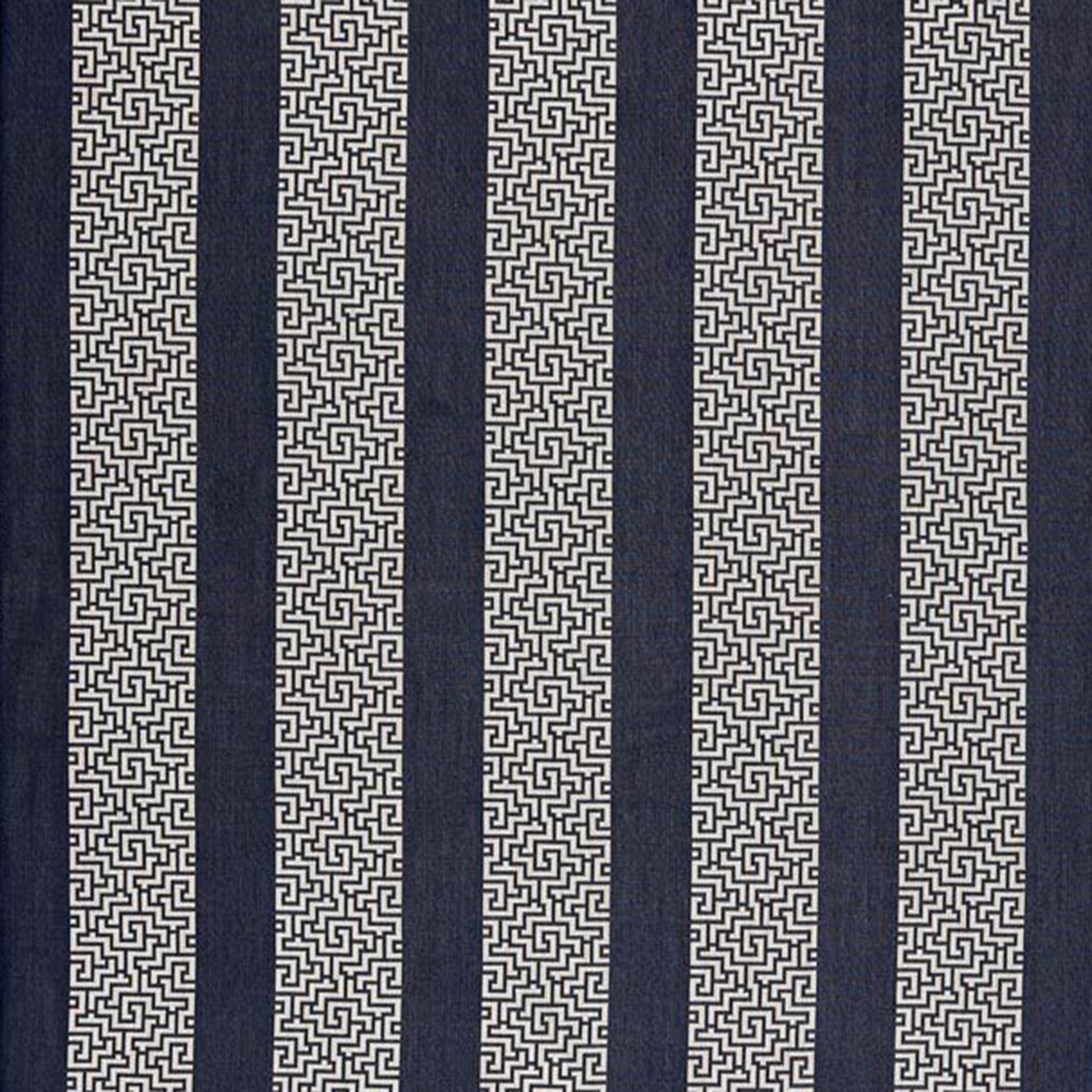 Navy blue fabric with cream Greek-key meander stripes; alternating solid navy bands and patterned cream columns.