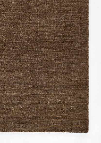 Brown textured woven rug with tight fibers and clean edge.