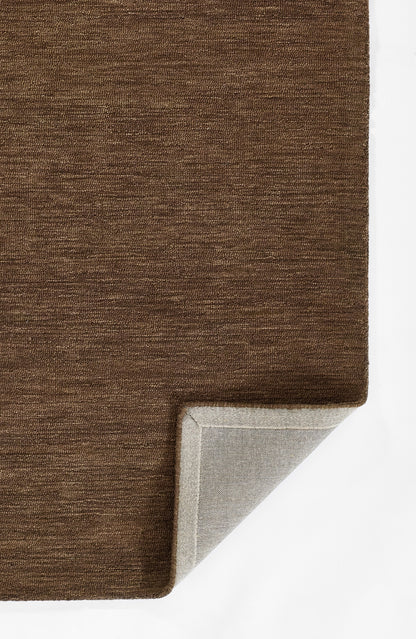 Brown textured rug with a light gray underside visible at the folded corner.