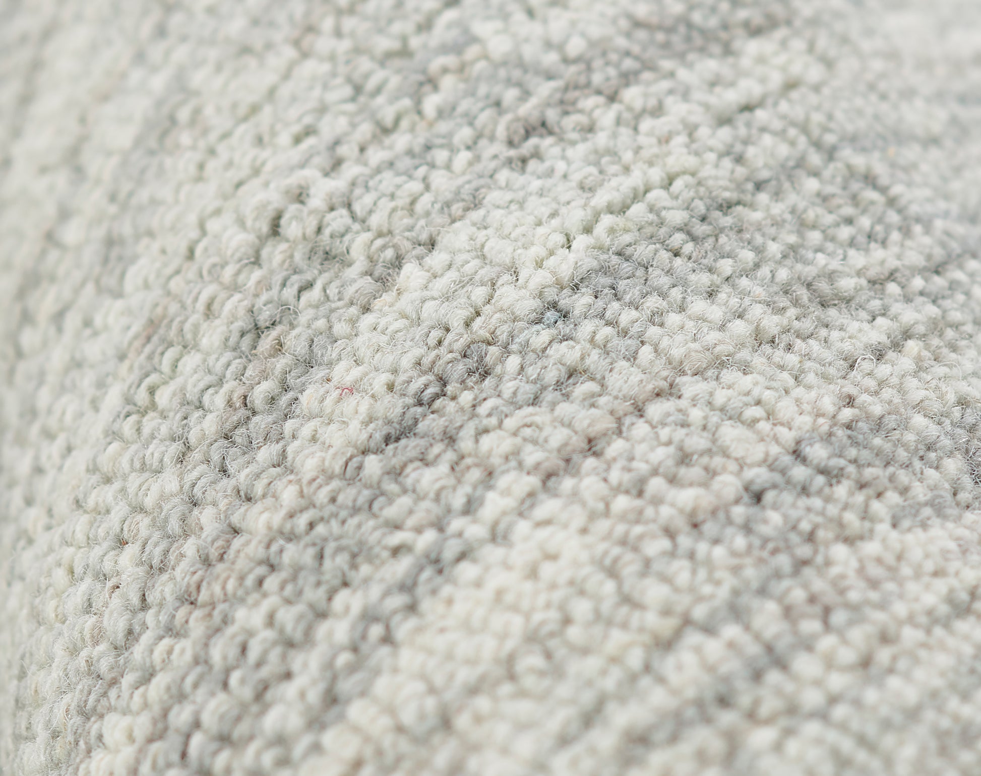 Close-up of beige-gray boucle runner rug with soft loop pile, neutral textured home decor, 2'3" x 8'.