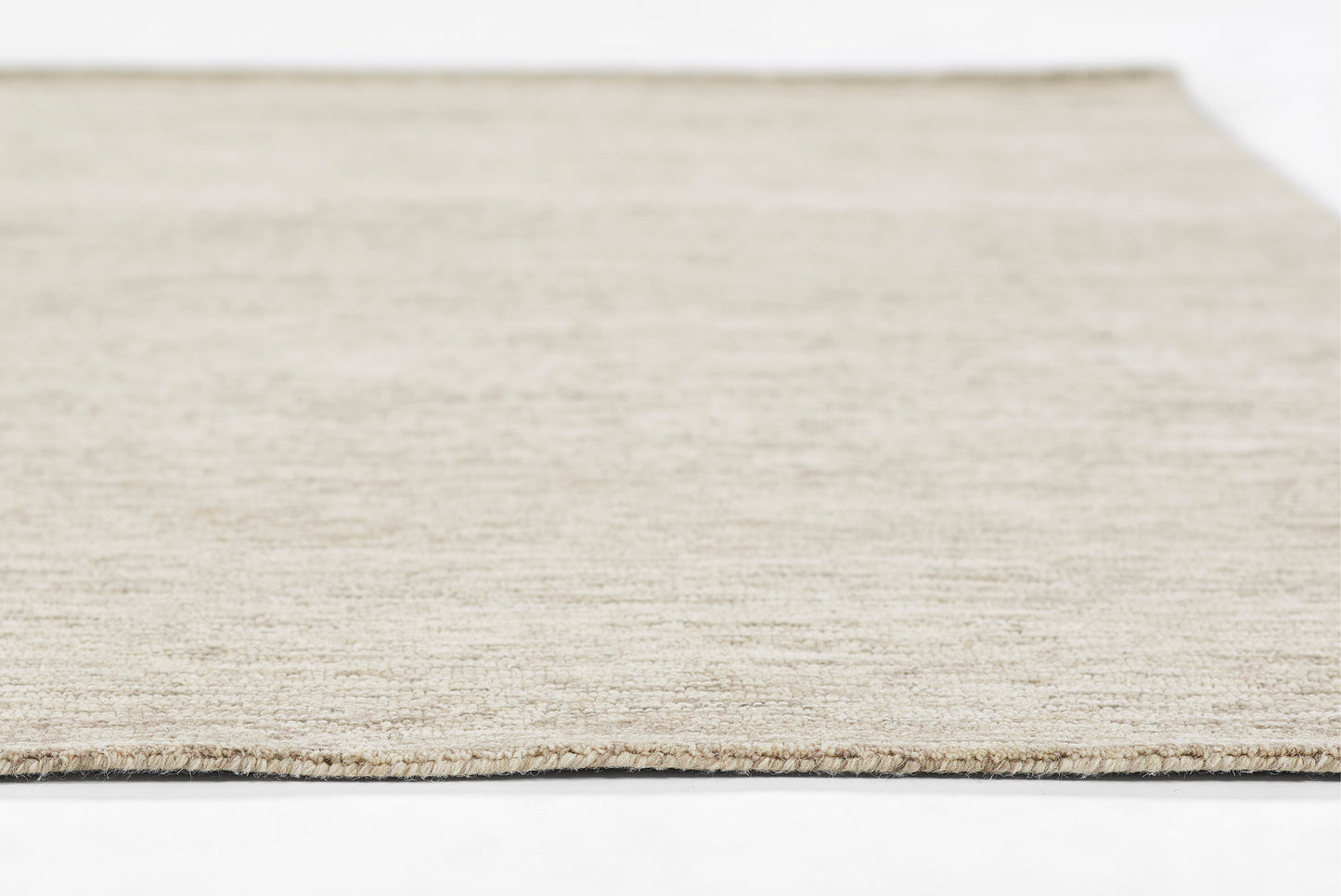 Natural beige flatwoven jute rug with textured fibers, rectangular shape, casual coastal style for living spaces.
