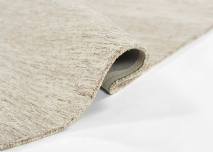 Beige natural-toned textured rug, looped weave, partially rolled on white background.