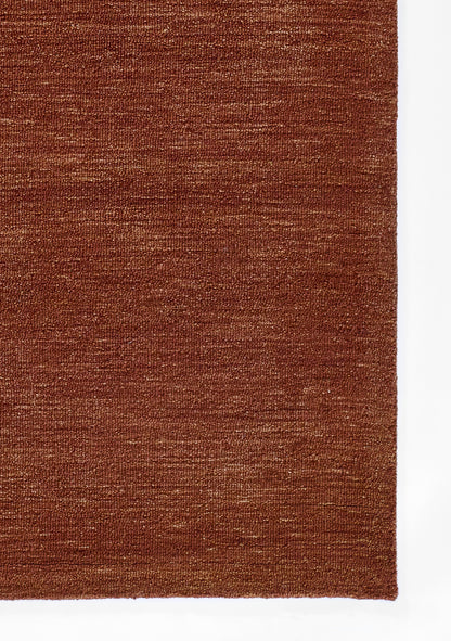 Rust-brown woven rug with subtle texture; rectangular, short-pile rug for living room or bedroom (5' x 8').
