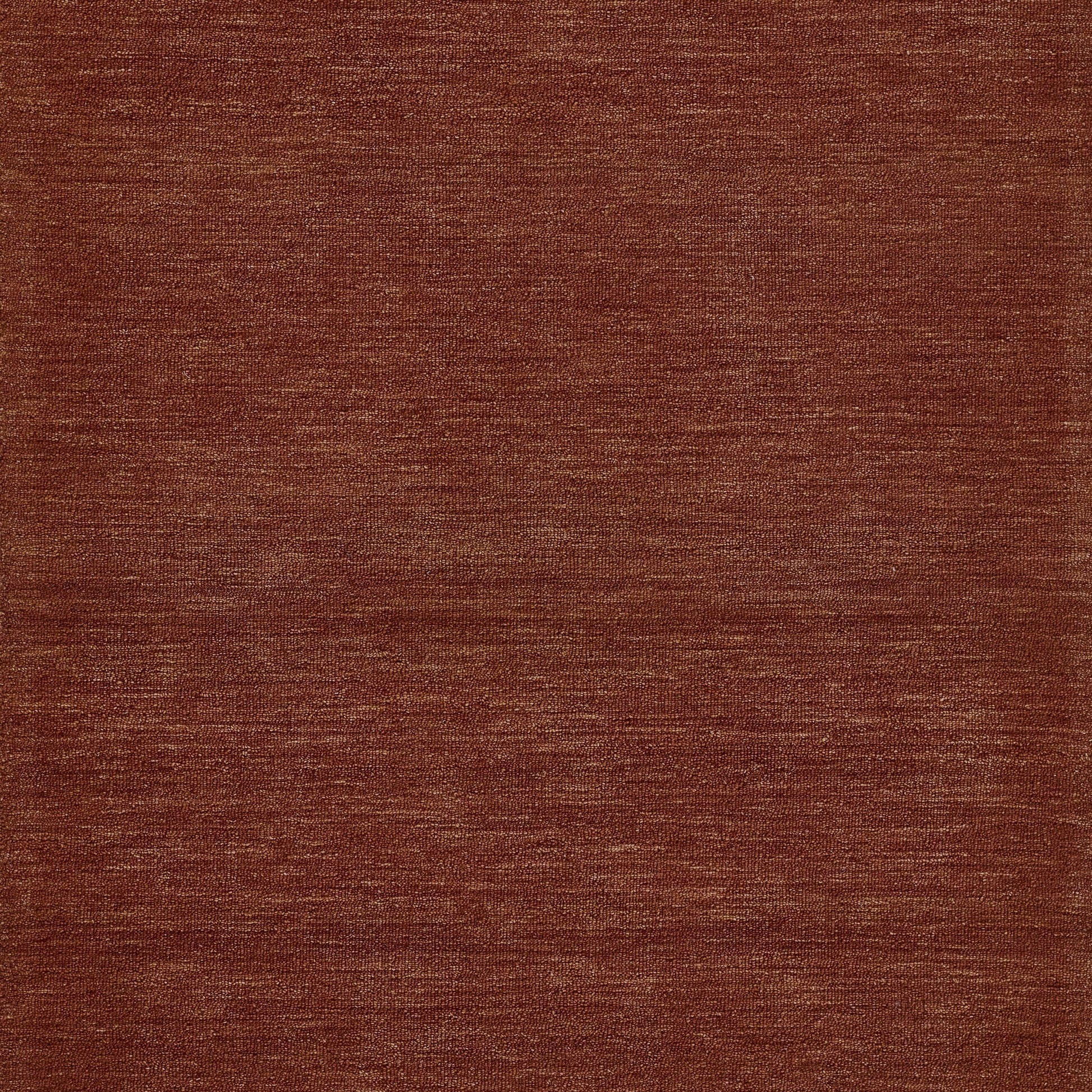 Rust-brown woven rug texture with subtle horizontal lines.