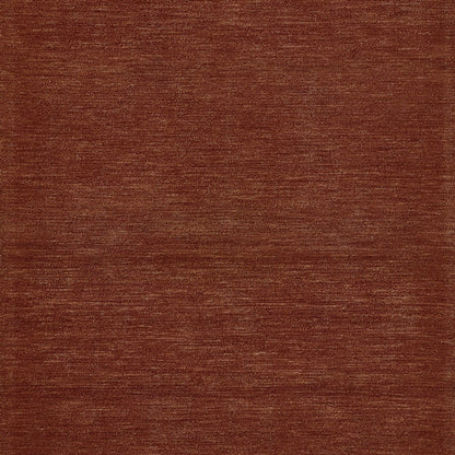 Rust-brown woven rug texture with subtle horizontal lines.