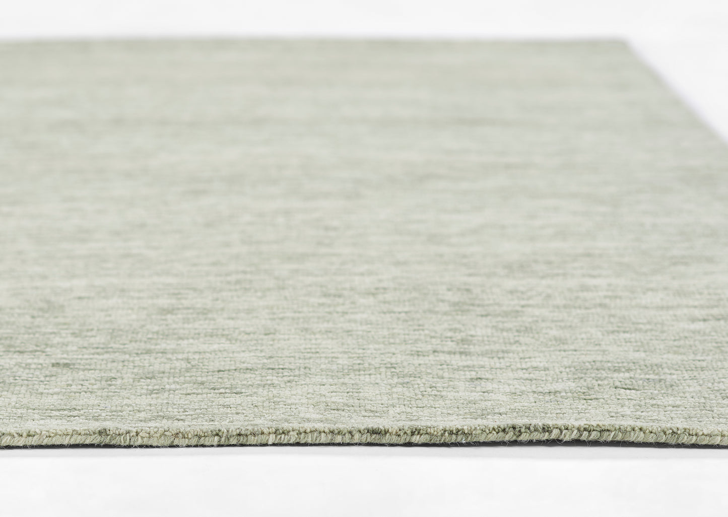 Light gray woven rug with low pile texture, rectangular shape, soft and modern for contemporary spaces.
