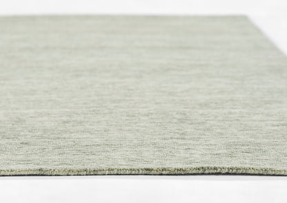 Light gray woven rug with low pile texture, rectangular shape, soft and modern for contemporary spaces.