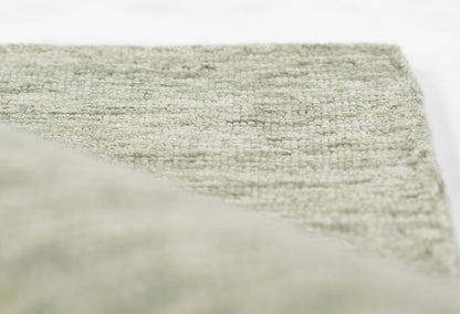 Light gray textured rug with boucle woven pile, soft fibers for modern floor decor.