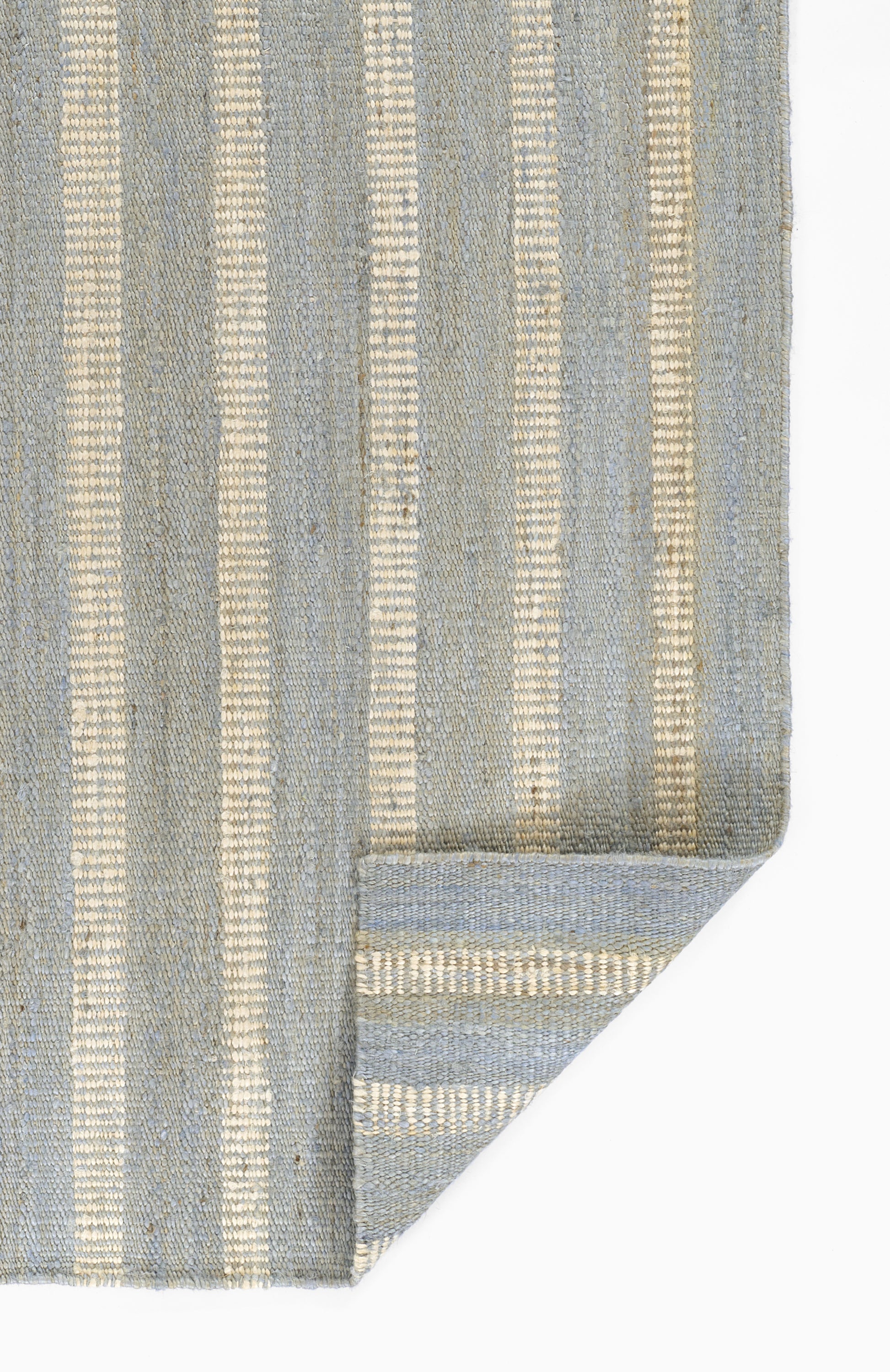 Blue and beige striped woven rug with vertical stripes and folded corner detail.