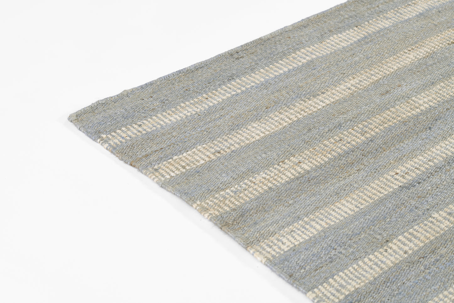 Gray-blue striped flat-weave rug with beige bands and visible woven texture.