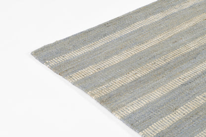 Gray-blue striped flat-weave rug with beige bands and visible woven texture.