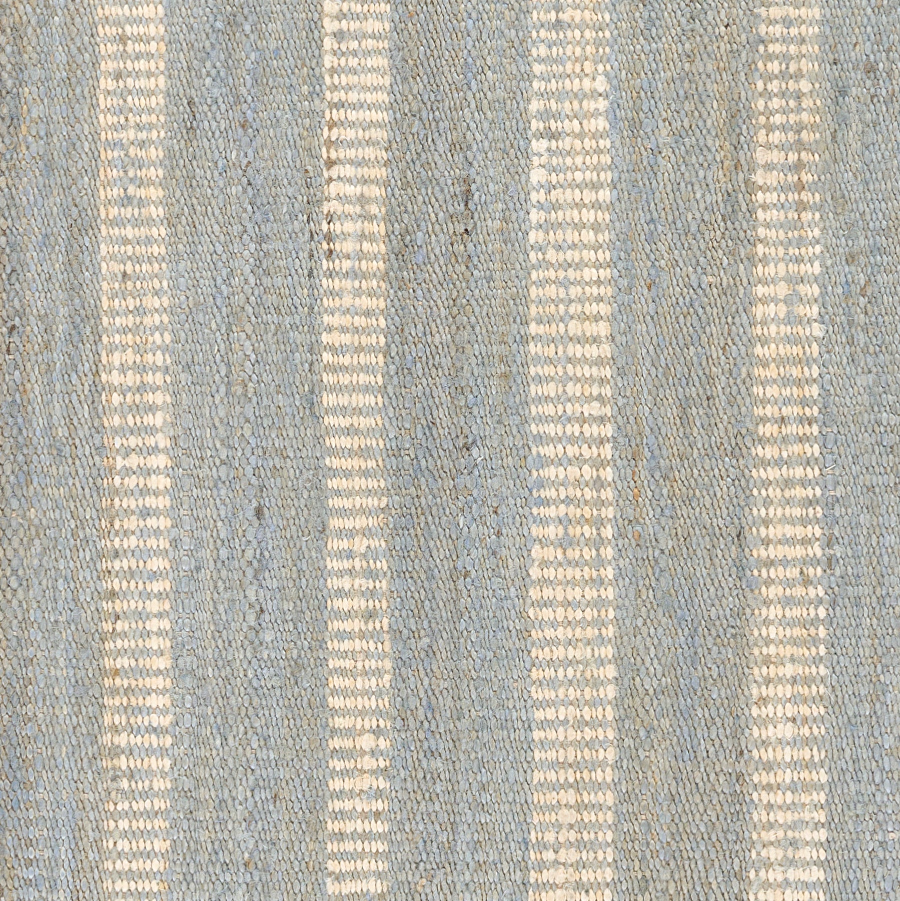 Blue woven rug with cream vertical stripes and textured surface.