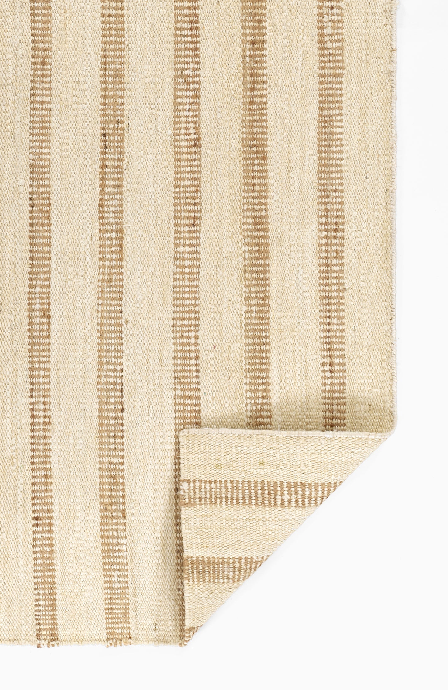 Beige woven rug with vertical brown stripes; natural fiber, folded corner.