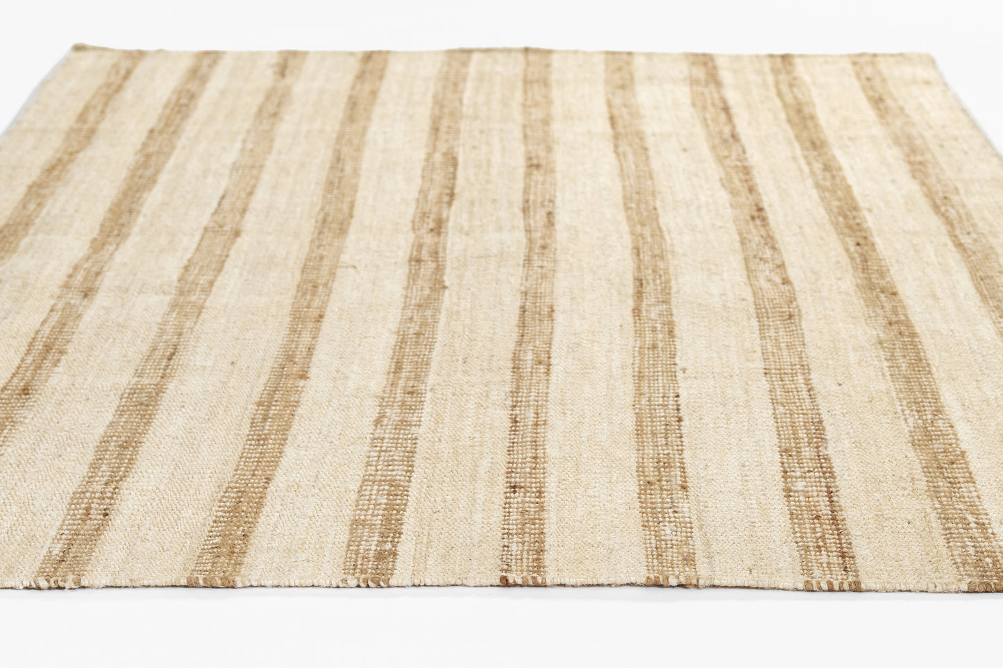 Beige flat-weave rug with vertical tan stripes; natural jute texture, rectangular for living room decor.