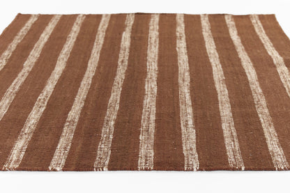 Flat-woven brown rug with cream vertical stripes; rustic boho rectangular area rug.