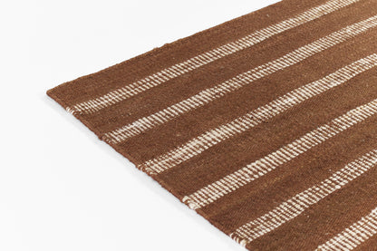 Brown rectangular woven jute rug with cream striped pattern and frayed edge.