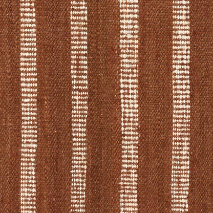 Brown woven textile with narrow white vertical dashed stripes in a rustic pinstripe rug pattern.