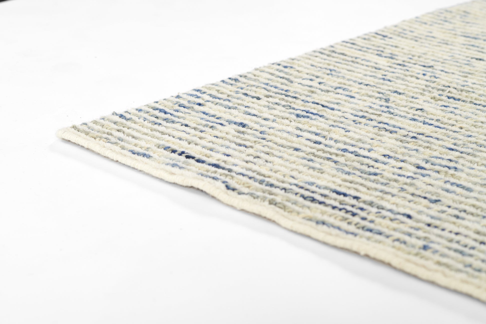 Cream cotton flat-weave rug with blue stripes, 2' x 3', woven texture and light fringe along edge.