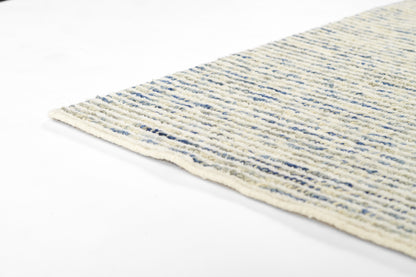 Cream cotton flat-weave rug with blue stripes, 2' x 3', woven texture and light fringe along edge.