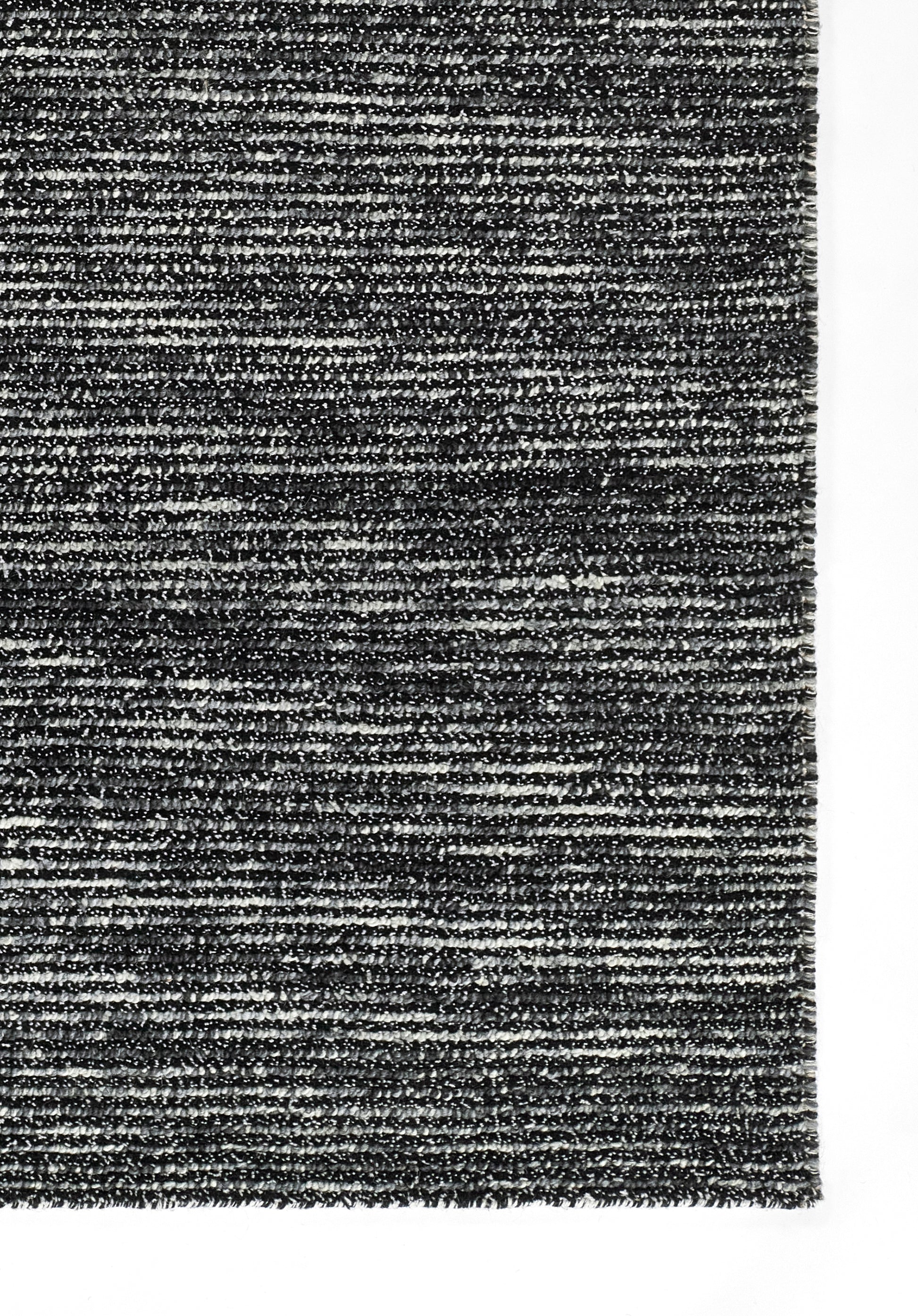 Charcoal gray woven rug with subtle white flecks, low-pile texture, modern striped look for living spaces.