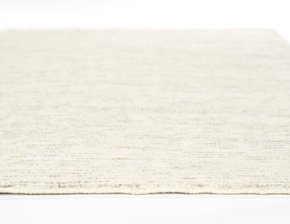 Cream ivory runner rug, 2'3" x 8', with soft textured pile and fringe edge.