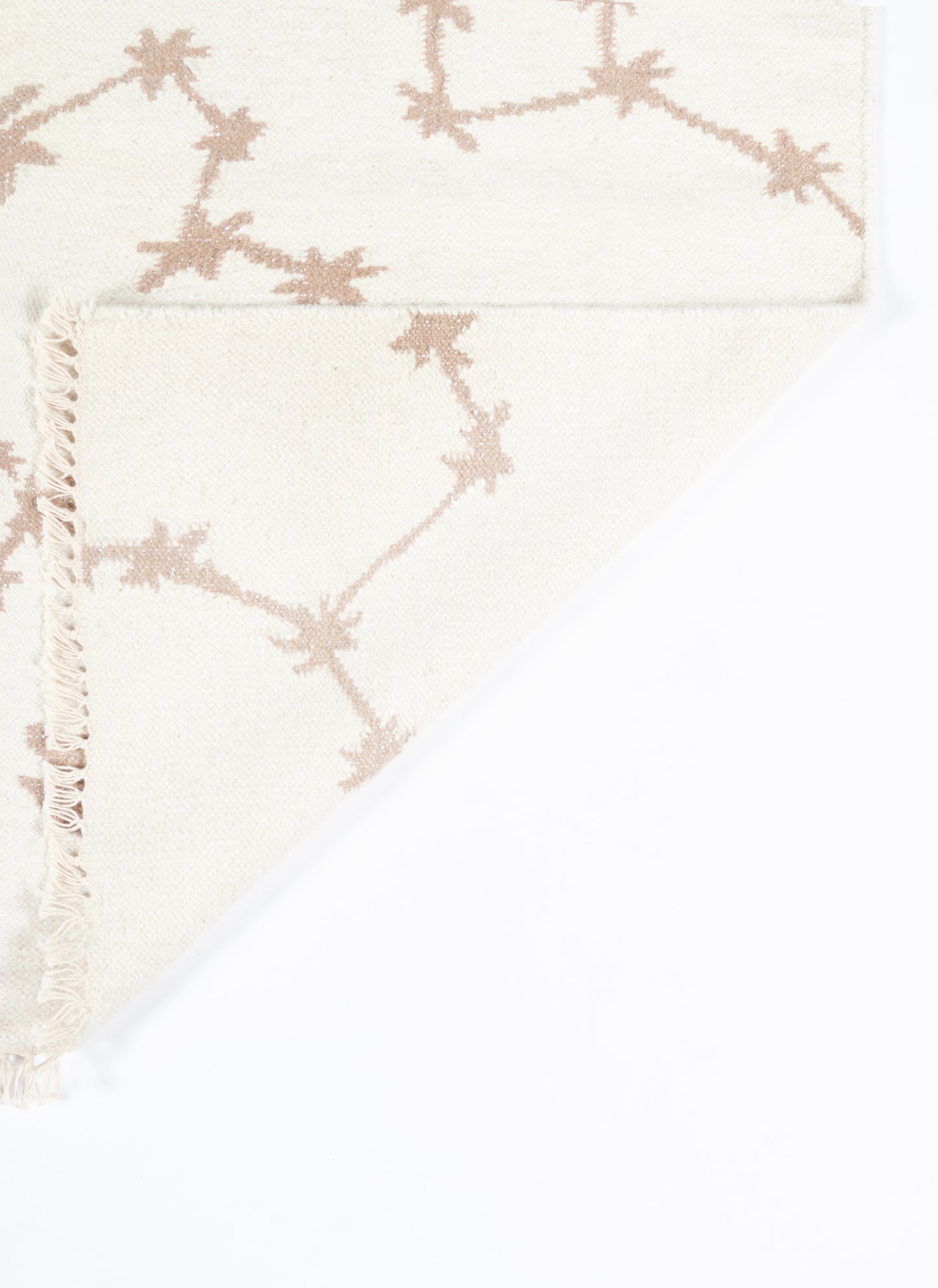 Cream woven rug runner 2' x 8' with a pink-taupe vine motif and a fringed edge.