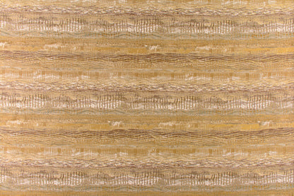 Woven fabric with horizontal wavy stripes in warm beige & gold tones; textured, boho-inspired design.