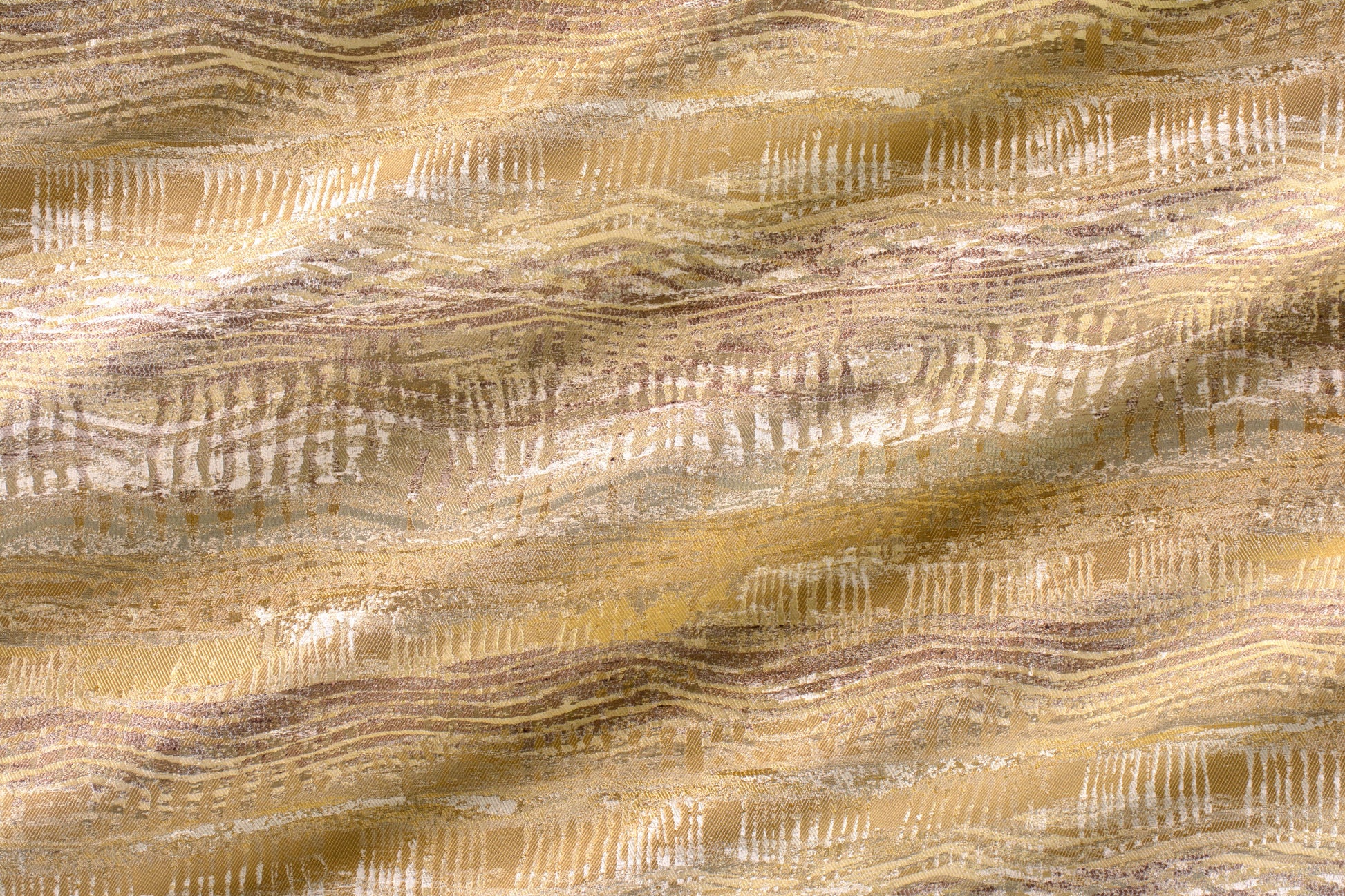 Gold and beige textured fabric with lavender-wash wavy stripes and white brush motifs; decorative upholstery textile.