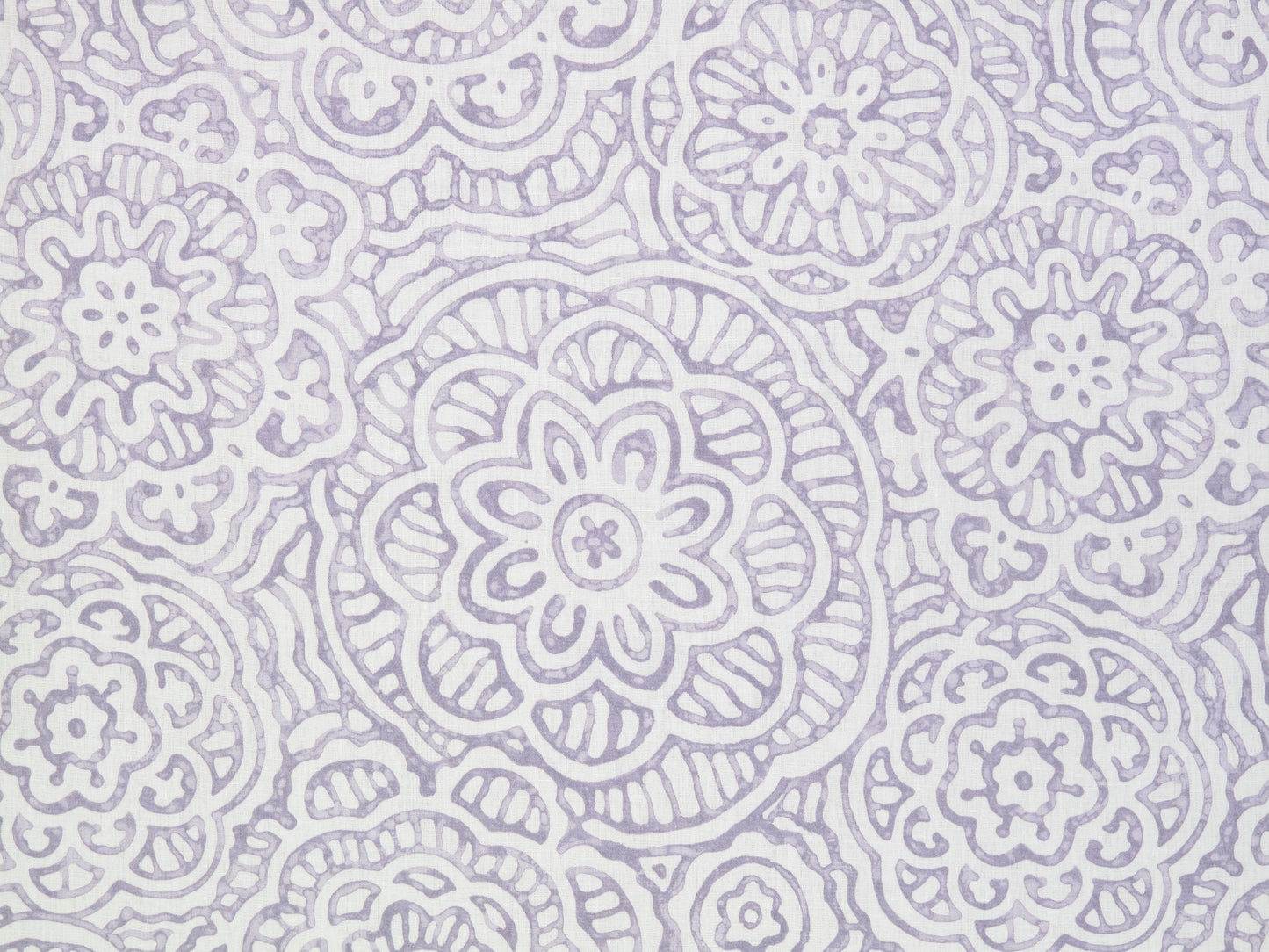 Soft lavender mandala floral pattern on a pale lilac background; intricate circular motifs, fabric texture.