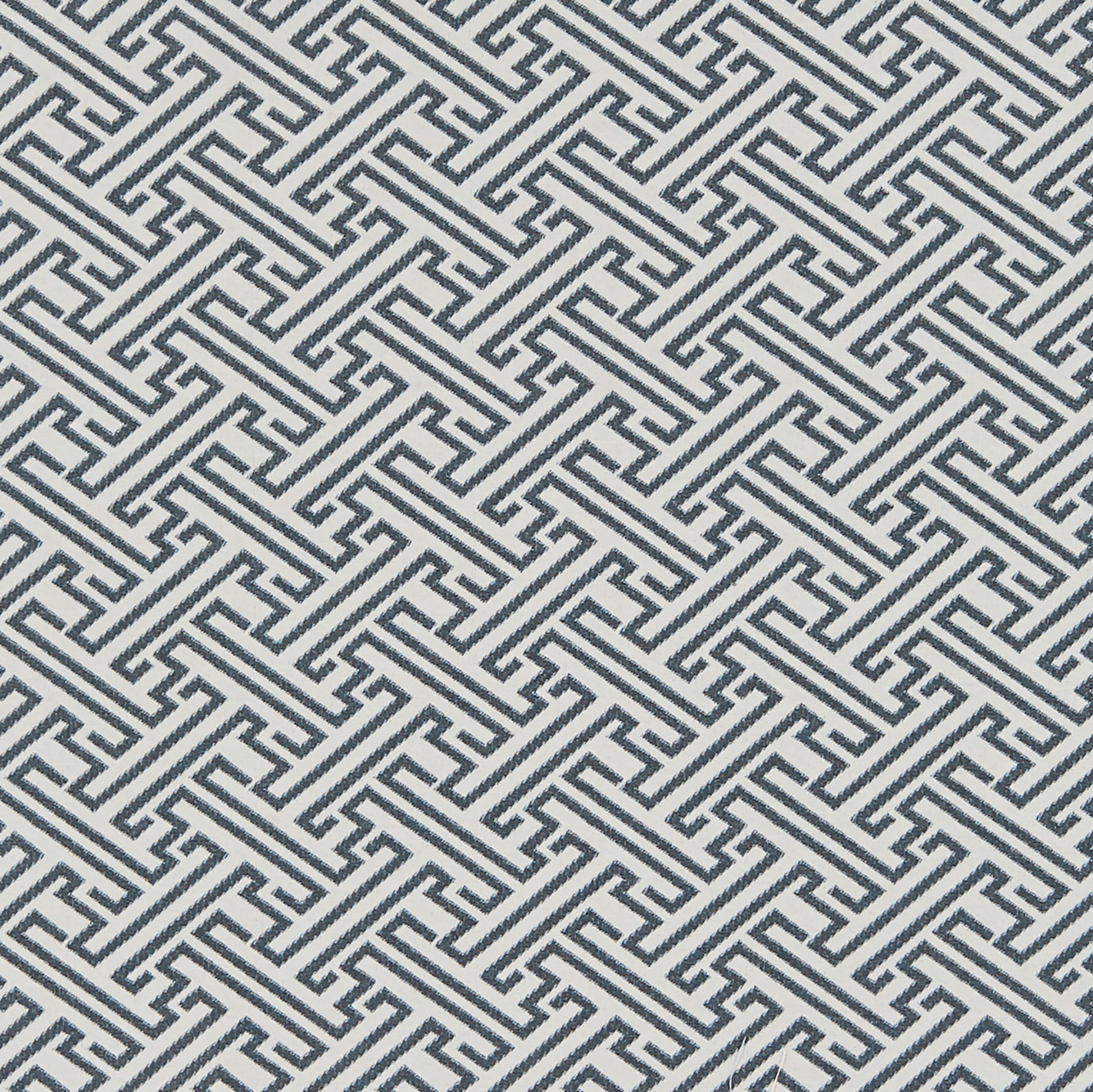Blue Greek key meander geometric jacquard fabric with interlocking lines, repeating pattern.