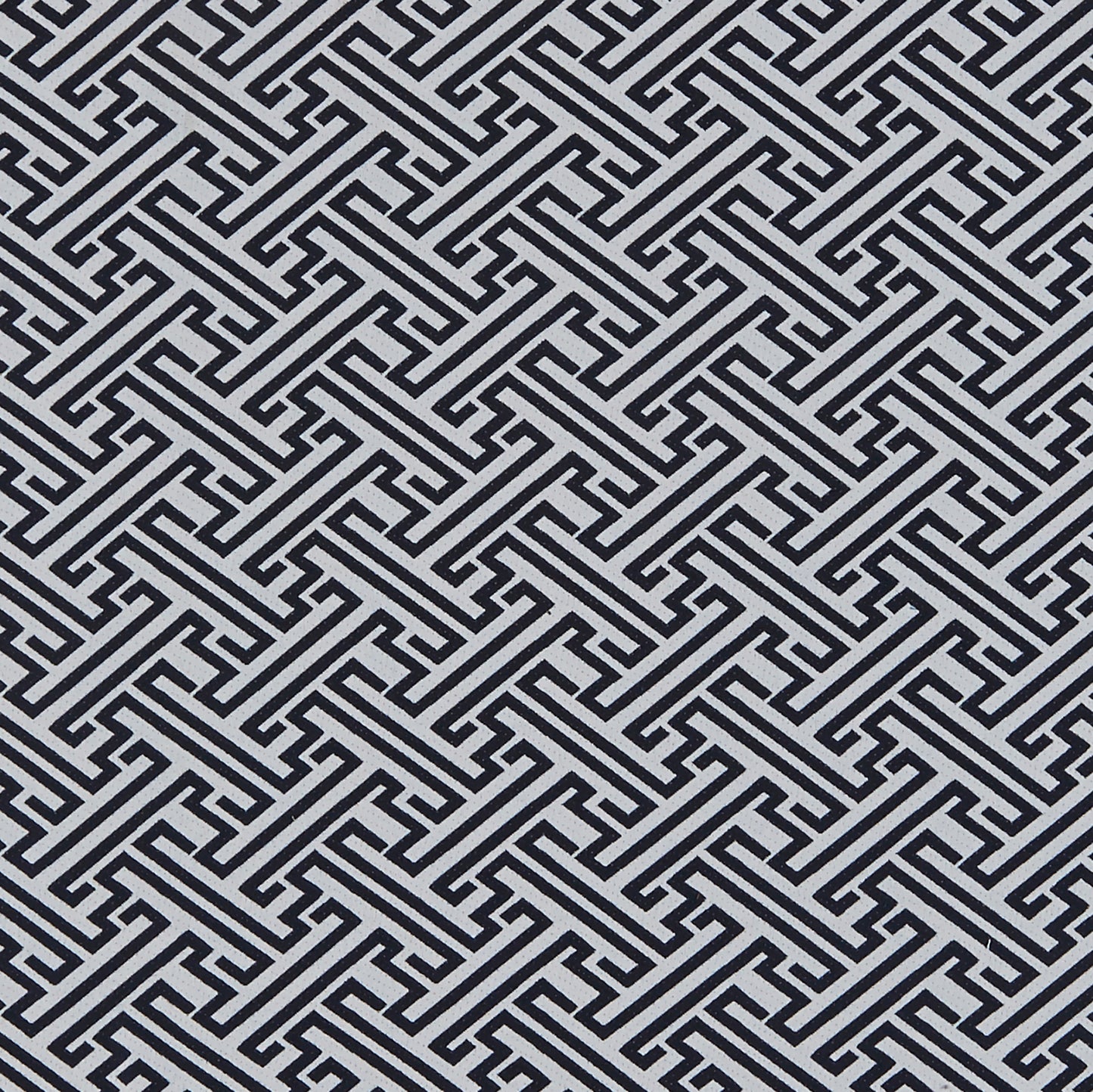 JOPLIN pattern: interlocking blue Greek-key motif on pale background; bold geometric jacquard fabric.