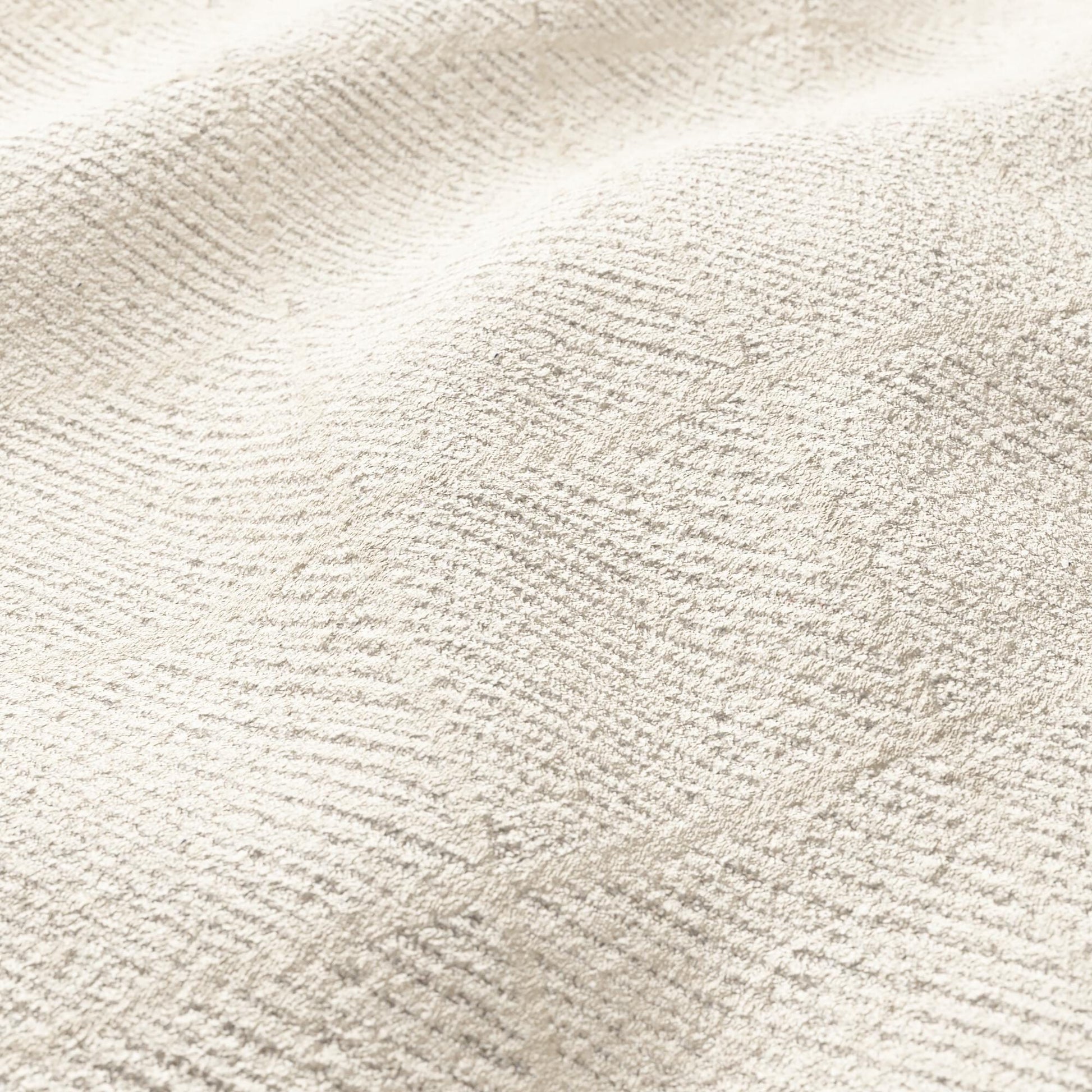 Beige velvet fabric close-up with plush pile and a subtle diamond pattern.