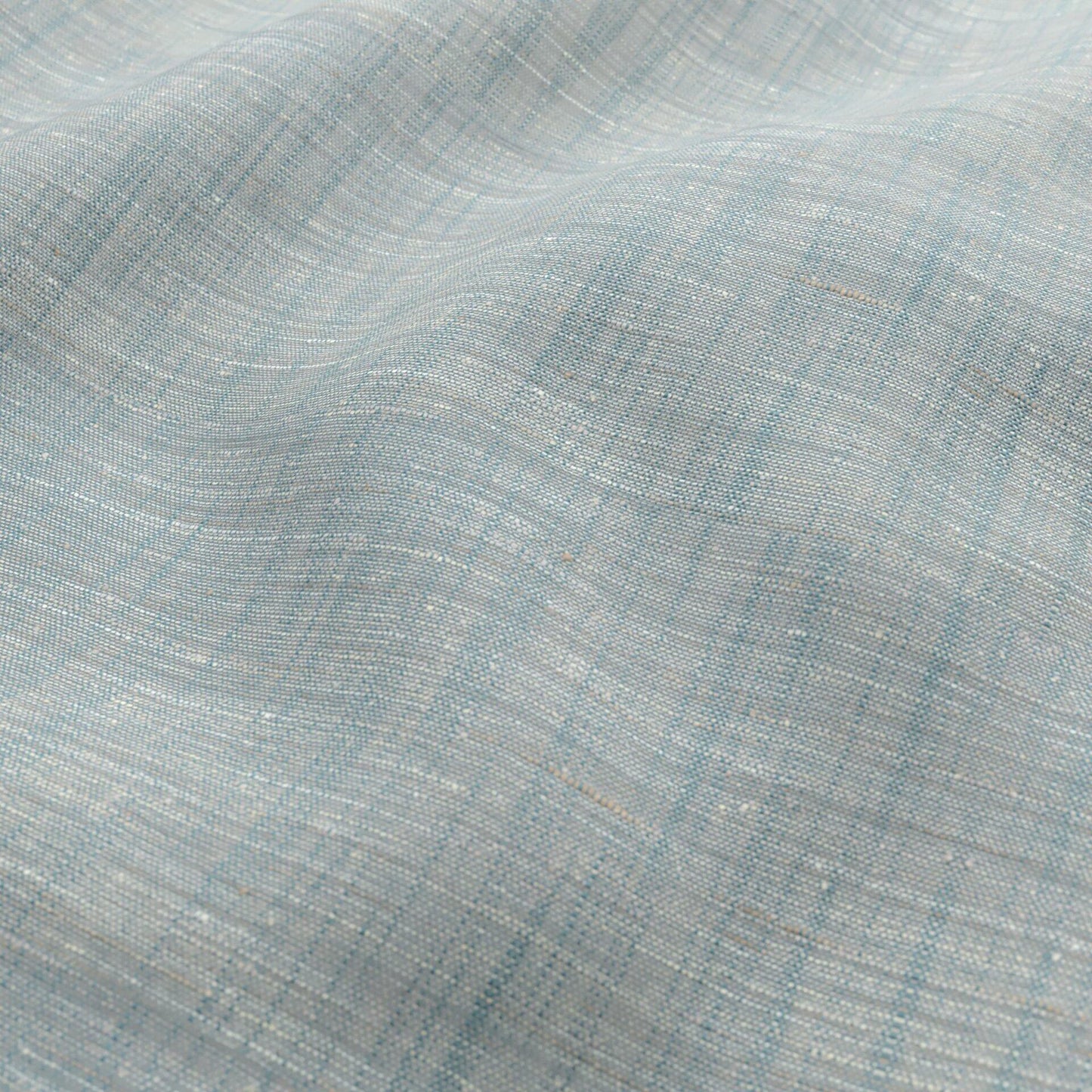 Light teal, cream and beige woven fabric with a subtle white speckle; sheer, wide width.