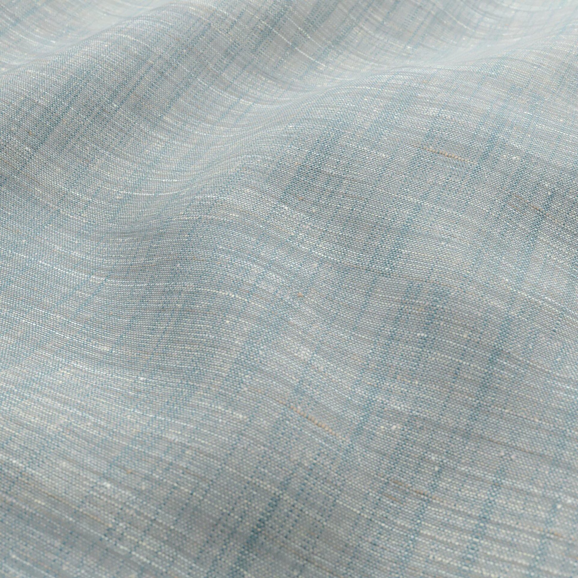 Light teal, cream and beige woven fabric with a subtle white speckle; sheer, wide width.