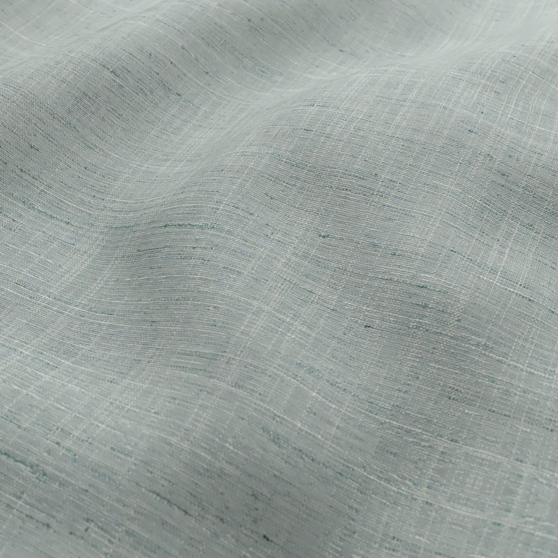 Seafoam, cream, teal linen-look fabric with a sheer woven texture, featuring a subtle striped weave and tiny specks, light drape for summer garments.