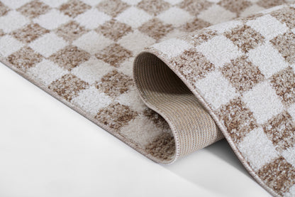 Beige and brown checkered rug with plush pile, rolled edge showing woven underside, cozy home decor.