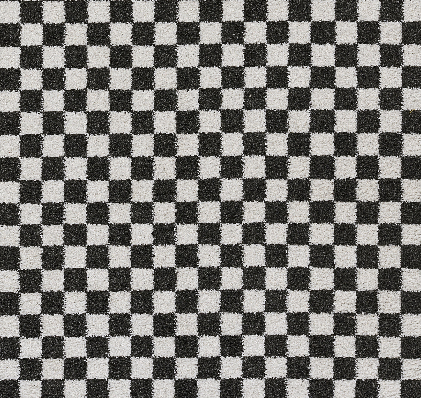 Black and white checkerboard fabric pattern with small squares.