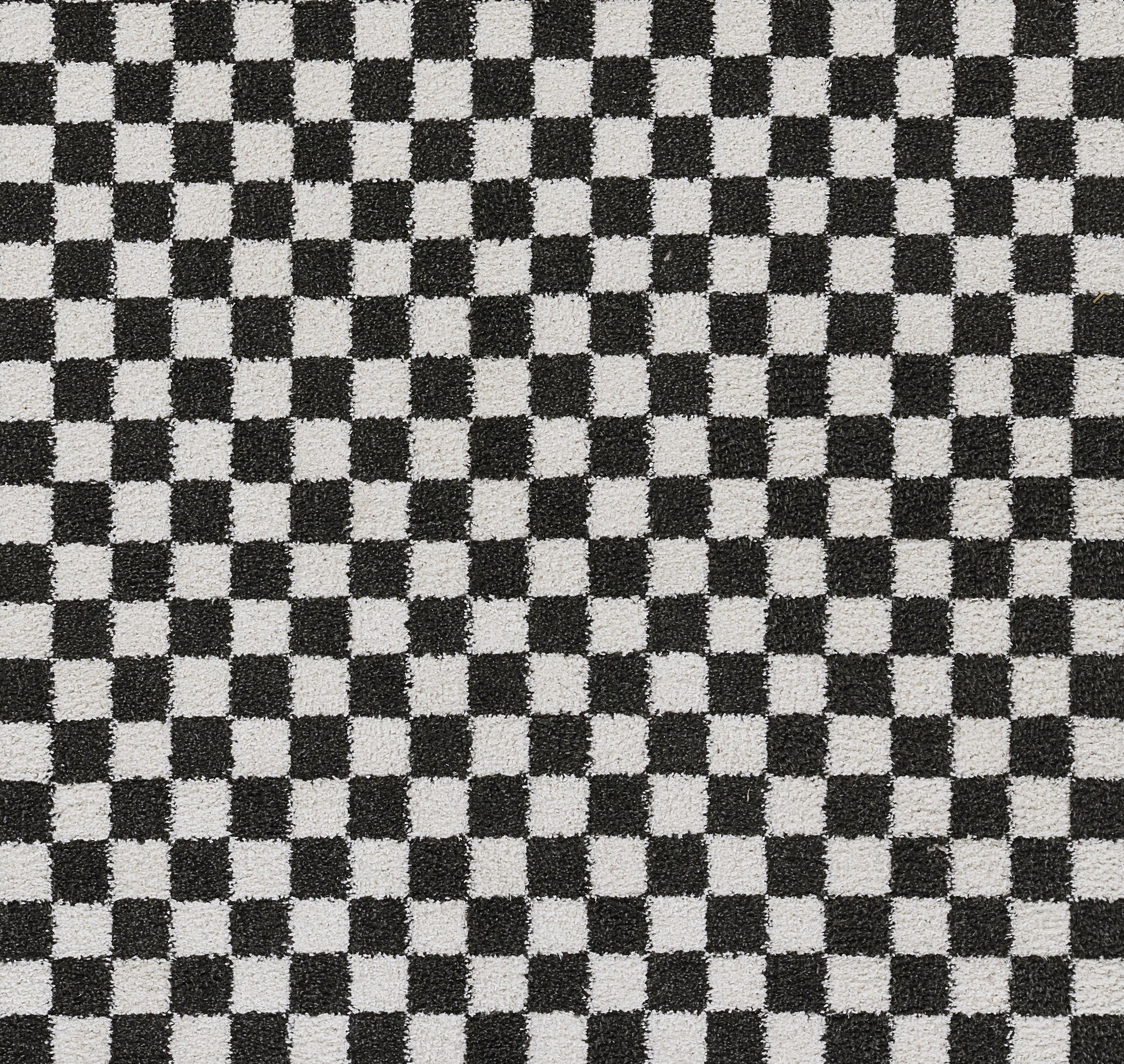 Black and white checkerboard fabric pattern with small squares.