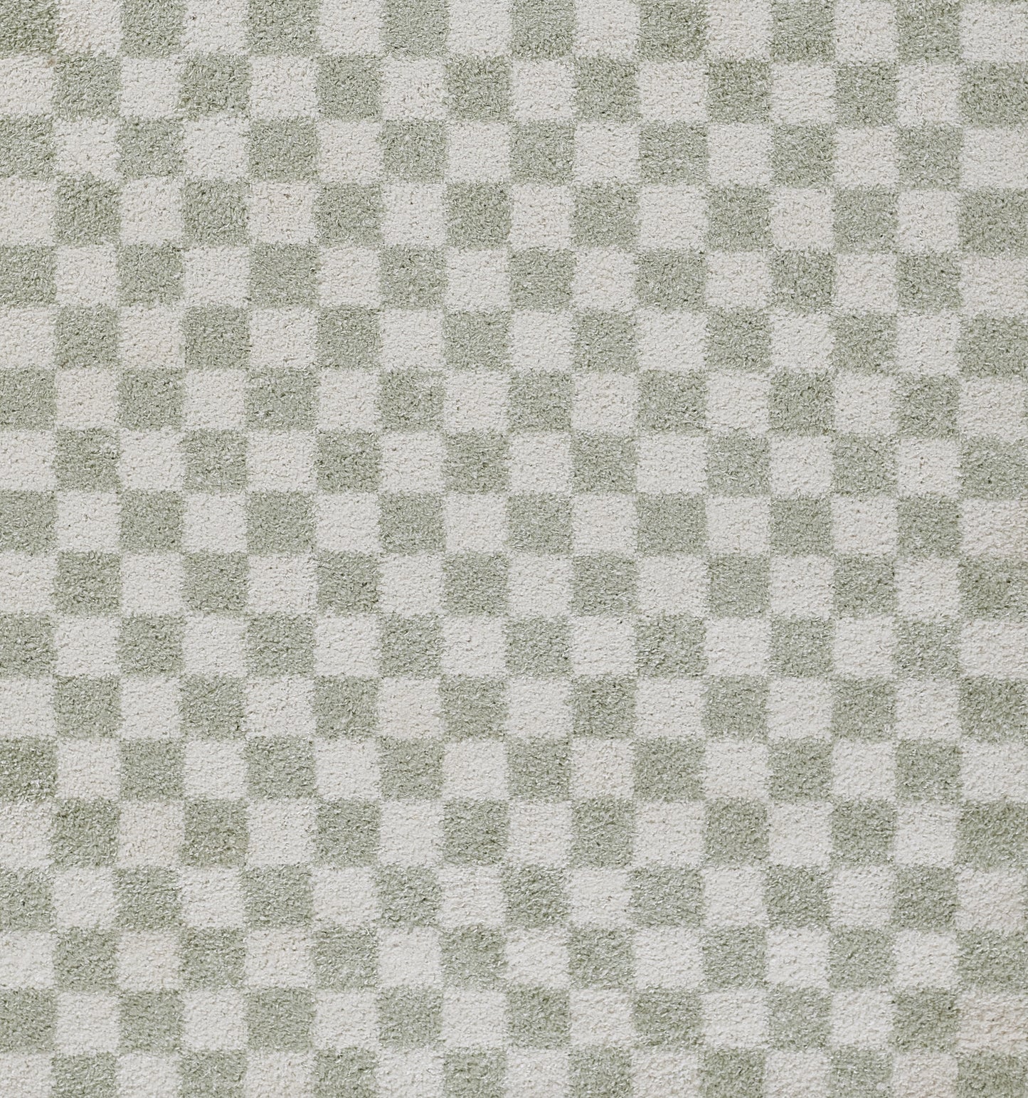 Green and light gray checkerboard woven rug with a speckled texture.