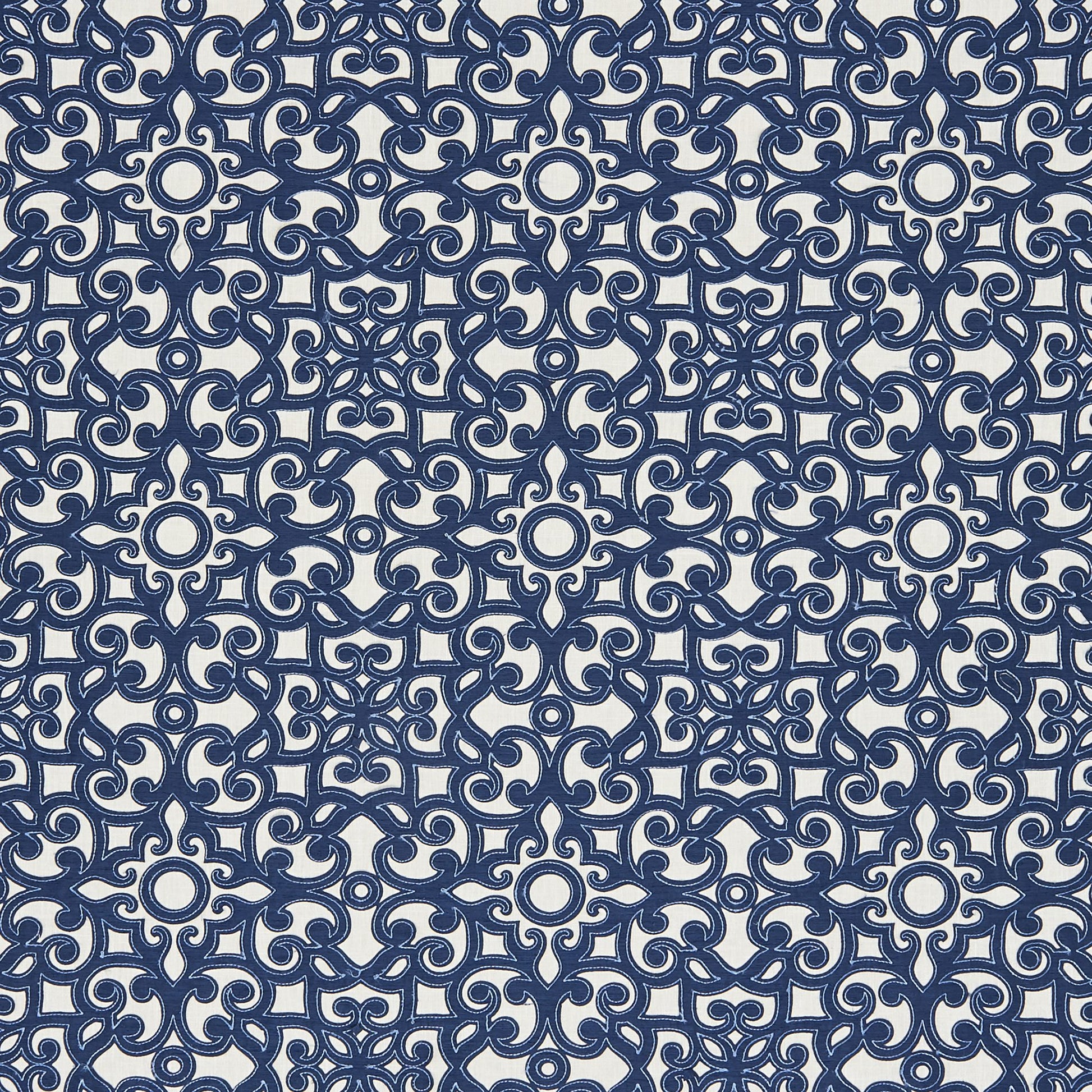 Navy blue and ivory damask tile pattern with circular medallions; ornate print for wallpaper or upholstery.