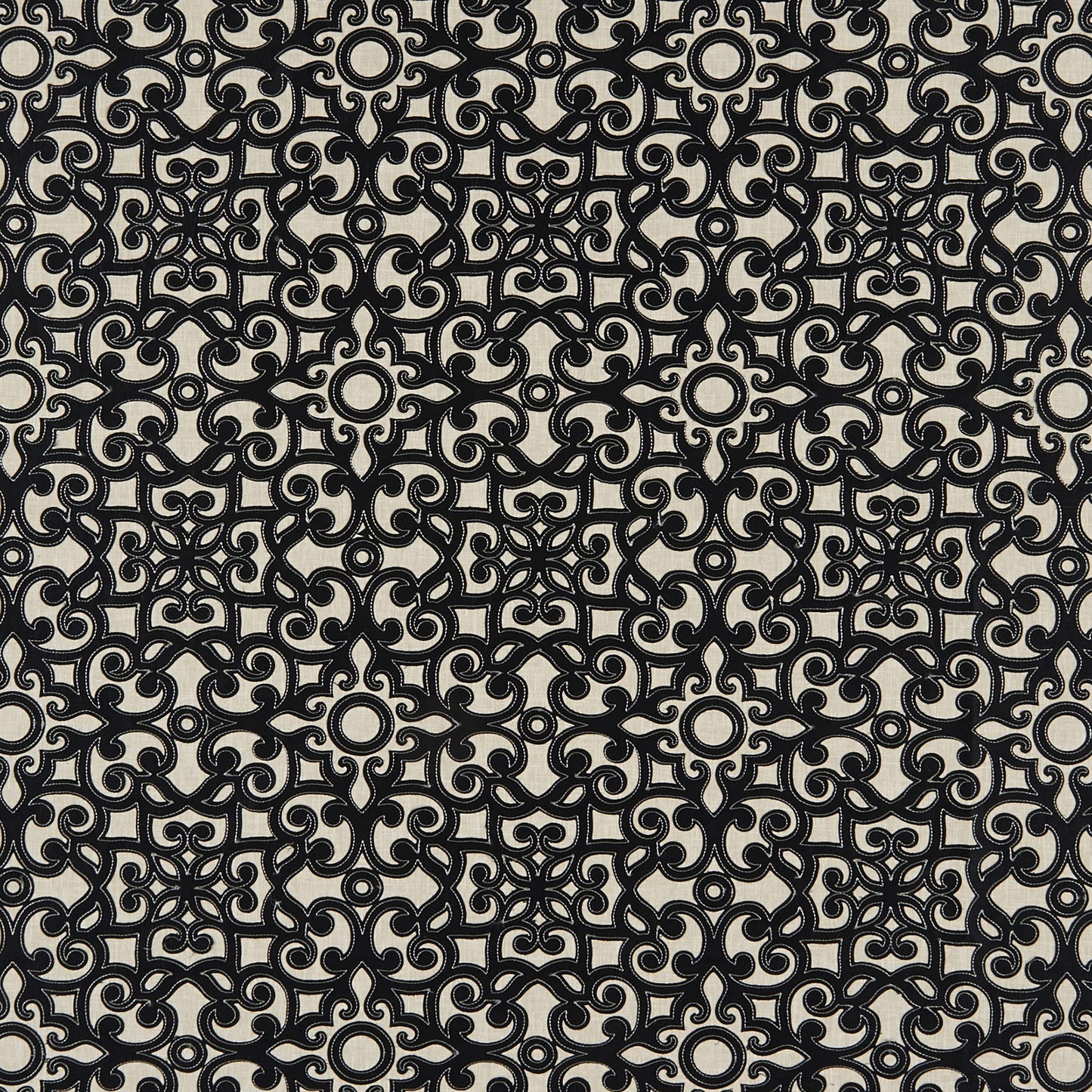 Beige fabric with dense black damask-inspired scroll pattern; interlocking circles and curls for upholstery.