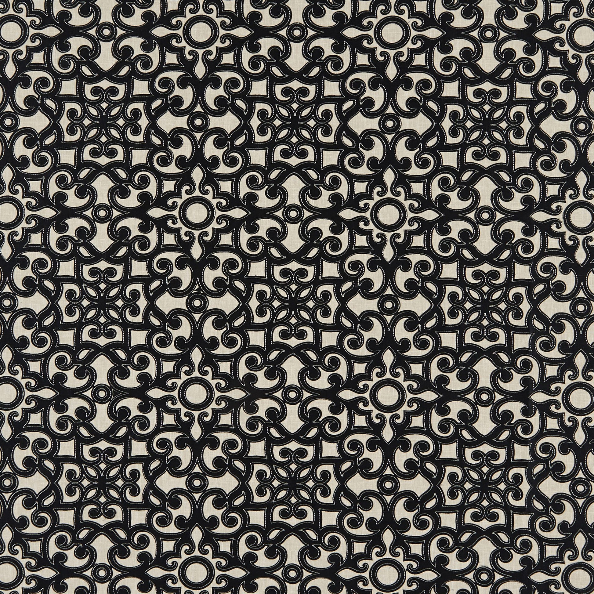 Beige fabric with dense black damask-inspired scroll pattern; interlocking circles and curls for upholstery.