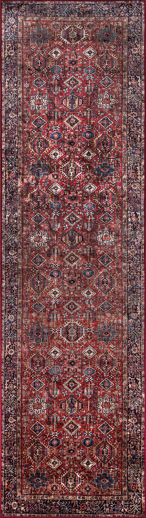 Persian-style rug runner with red field, geometric diamond motifs, ivory and navy accents, and an ornate bordered edge.