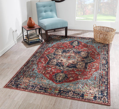 Colorful oriental runner (2' x 8') with a red central medallion, navy border and teal accents in a bright room with a turquoise chair.