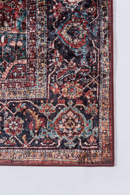 Persian-style oriental rug corner with red, navy, teal floral motifs and ornate borders.