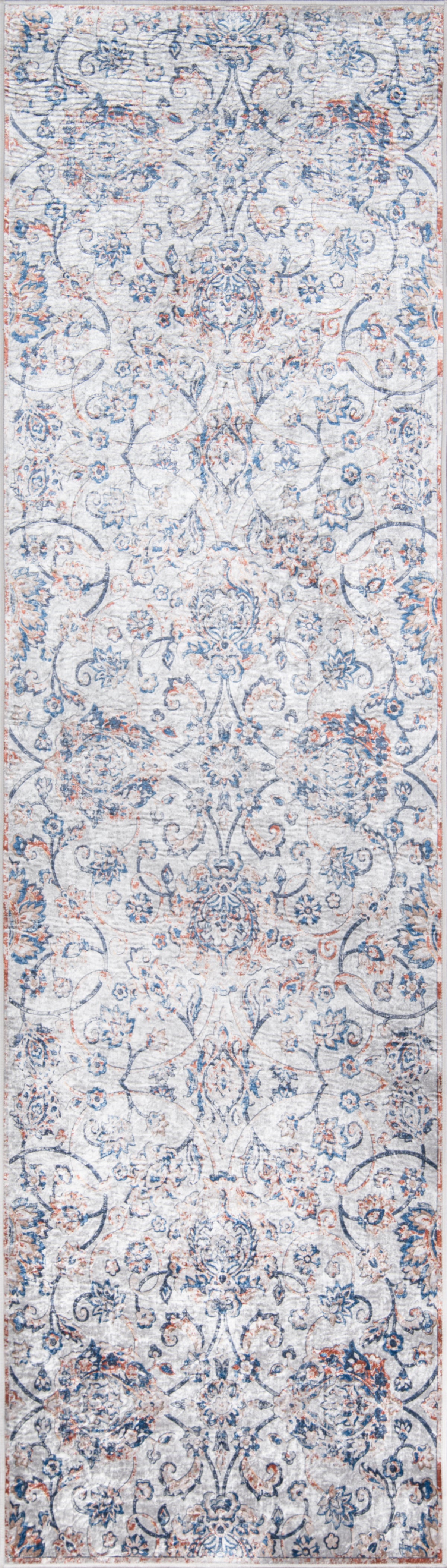 Long narrow runner rug with distressed oriental pattern in blue, ivory and rust tones.